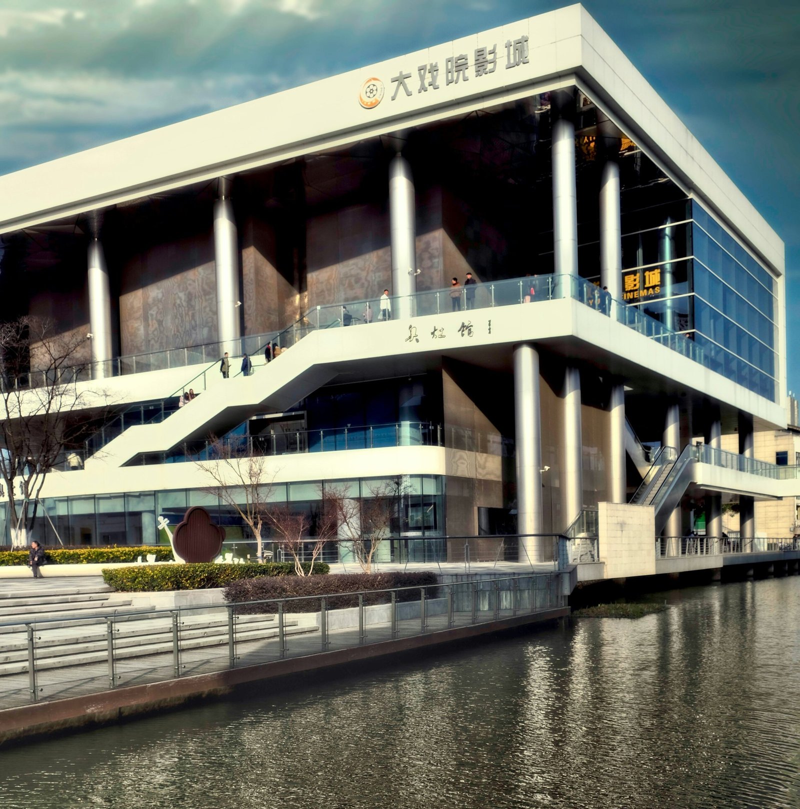 a large building sitting next to a body of water